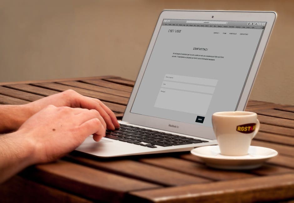 Browsing a website on a laptop over coffee